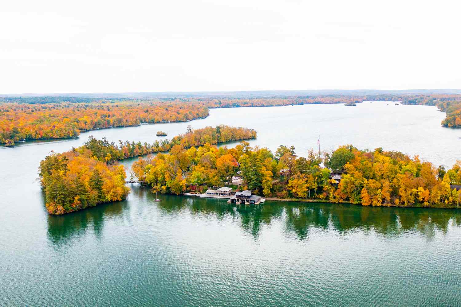 This 12-acre Private Lake Island in the Midwest Is Perfect for a Summertime Escape– With a 23-room Lodge and Cozy Cabins